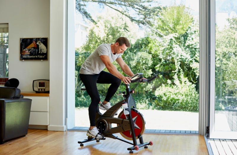 men exercise with bike